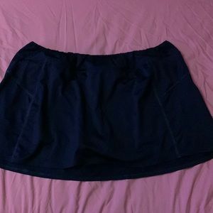 dark blue short sport skirt, has gray shorts built in underneath and super comfy